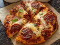 Pyszna pizza z pepperoni, z ciągnącym się serem i świeżą bazylią, przygotowana w air fryerze.