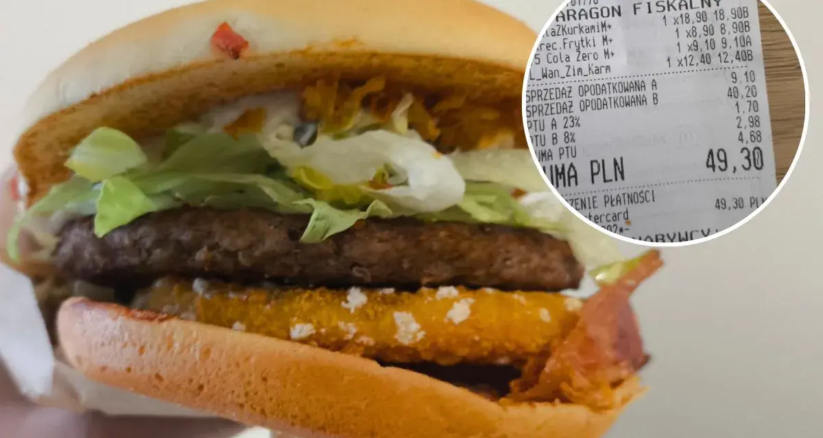 Drwal z chrzanem w burgerze, obok paragon z zakupami.